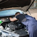 Technician performing engine repair work under the hood at Southport Auto Repair in Fort Lauderdale